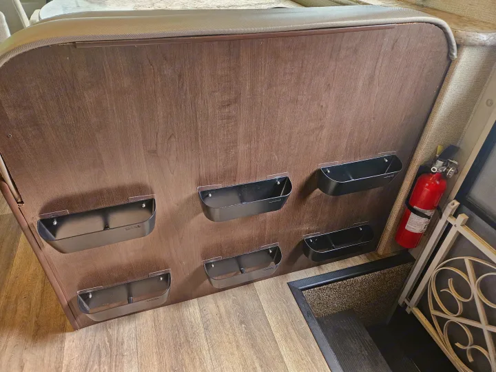 RV rental: Organized interior with wall-mounted storage bins for essentials and a fire extinguisher by the door.. Thor Freedom Elite 2018