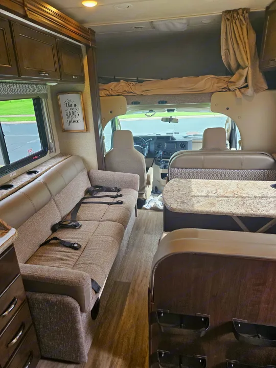 Step inside this comfortable rv rental: sofa with seatbelts, dinette, and overhead bunk ready for your next adventure.. Thor Freedom Elite 2018