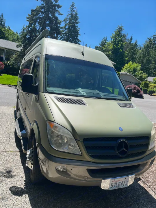 Explore the world with this olive green Mercedes Sprinter RV rental, perfect for your next adventure.. Other Other 2012