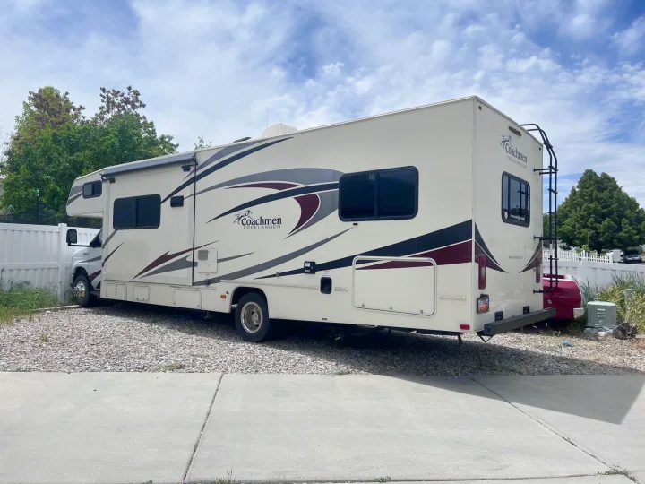 Coachmen Freelander RV parked on gravel. This spacious motorhome is ready for your next RV rental adventure.. Coachmen Freelancer 2019