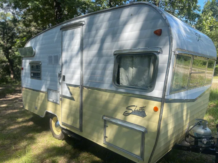 Eye-catching white and cream vintage Shasta travel trailer, available for RV rental. Ideal for classic camping.. Shasta Airflyte 2016