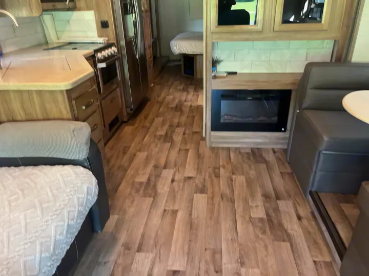 Electric fireplace and plenty of cabinets. Jayco Precept 2020