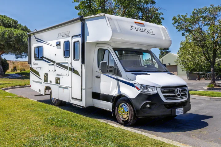 A white Mercedes-Benz Prism by Coachmen Class C RV rental motorhome is ready for your next road trip.. Coachmen Prism 2023