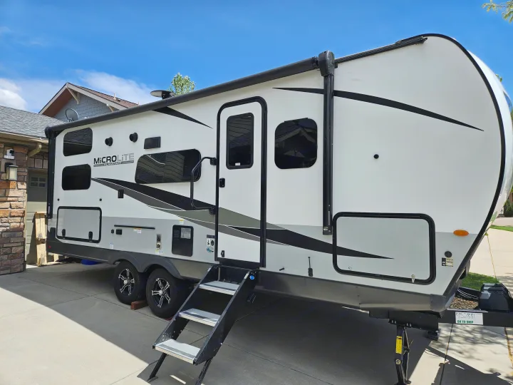 Explore with this modern white MicroLite travel trailer, ideal for an RV rental getaway.. Forest River Flagstaff Micro Lite 2023