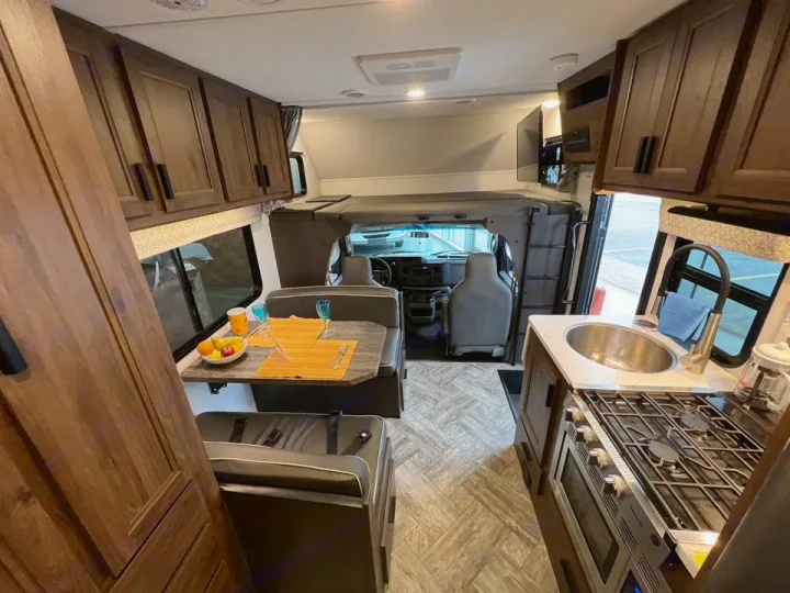 RV rental interior: Full view of the kitchen, dinette, and cab-over bunk, perfect for travel.. Forester LE 2022