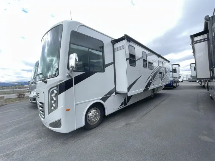 This sleek white RV motorhome, with its slide-out extended, is ready for your next adventure. Explore rv rental options.. Thor ACE 2024