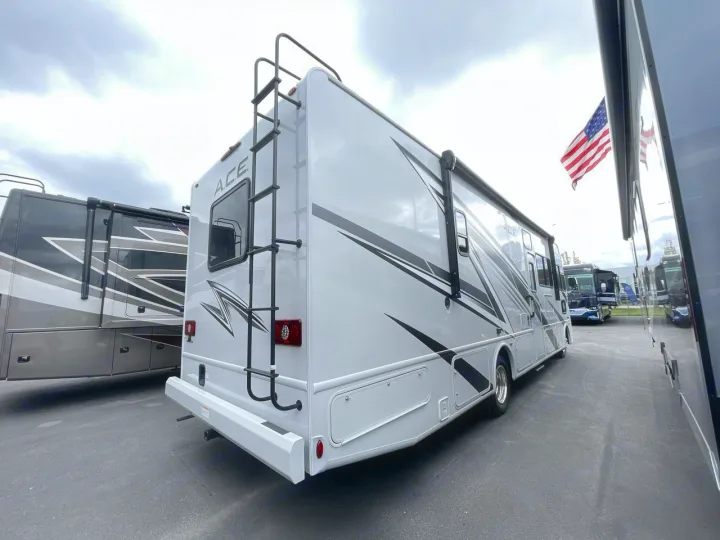 This grey Thor ACE RV motorhome is available for rv rental. See its rear ladder & side awning, ideal for outdoor travel.. Thor ACE 2024