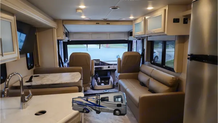 Spacious, modern RV interior featuring kitchen, dinette, sofa, and cockpit views for your next rv rental adventure.. Holiday Rambler Eclipse 2024
