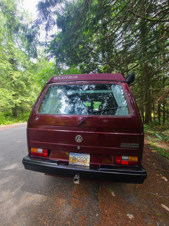 Rear view of a maroon VW Vanagon Westfalia camper van, ready for RV rental adventures in British Columbia.. Volkswagen T3 Mulitvan 1991
