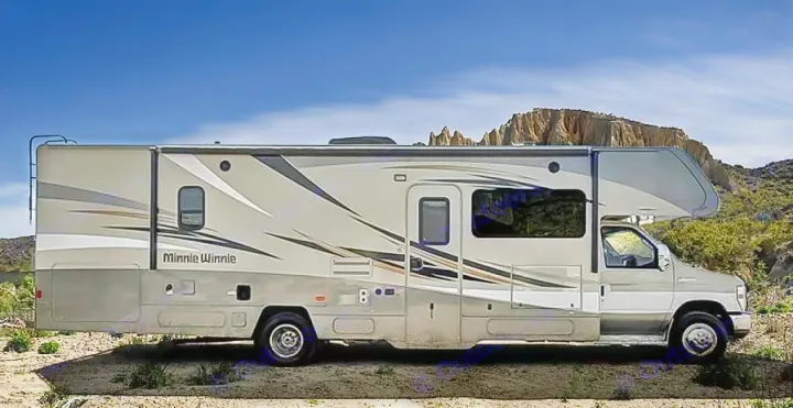 Minnie Winnie RV rental parked in a sunny, arid landscape with hills, ideal for scenic travel adventures.. Winnebago Minnie Winnie 2017