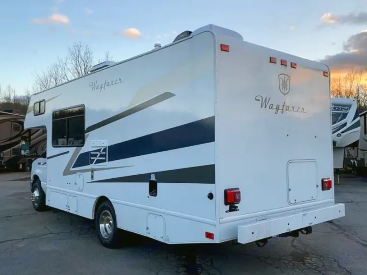 White "Wayfarer" motorhome RV rental with blue stripes, seen from the rear. Ideal for your next RV trip.. Tiffin Motorhomes Wayfarer 2021