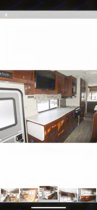 View of a spacious RV rental interior, highlighting the well-appointed kitchen, living area, and entry.. Forest River Sunseeker 2018