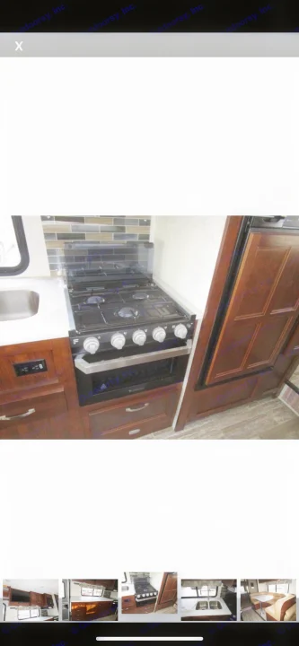 Enjoy cooking in your RV rental's kitchen, featuring a modern stove, oven, sink, and stylish tiled backsplash.. Forest River Sunseeker 2018