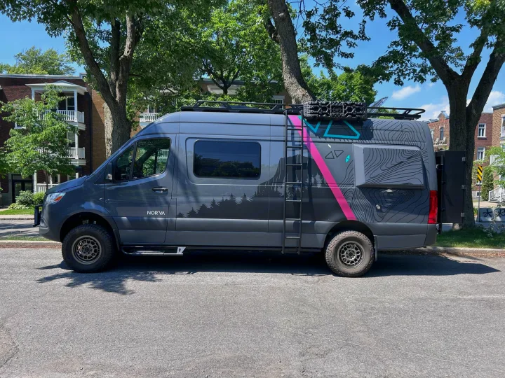 Adventure-ready gray custom camper van with unique graphics, ideal for RV rental and outdoor travel.. Mercedes sprinter 2500 170 AWD 2024