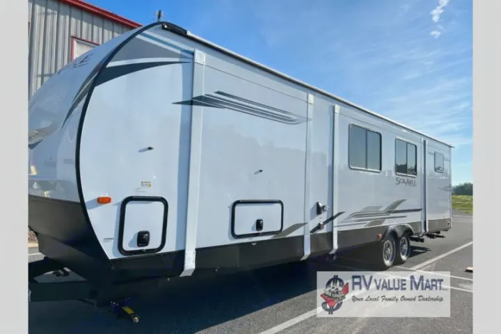 Sleek white SolAire travel trailer RV, ready for rv rental. Features large windows and modern graphics.. Forest River Palomino Solaire 2023