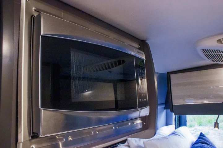 RV rental interior: Built-in microwave for easy meal prep on your journey.. Mercedes-Benz Sprinter 4x4 2022