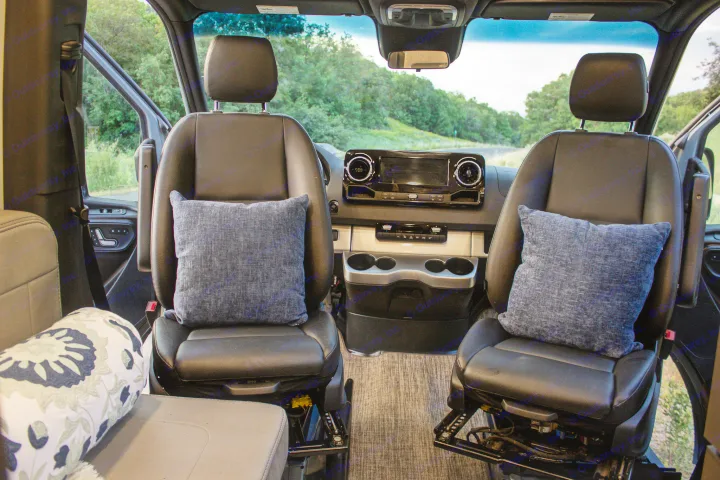 View from inside this spacious RV rental, highlighting the comfortable front seats, dashboard, and scenic outdoors.. Mercedes-Benz Sprinter 4x4 2022