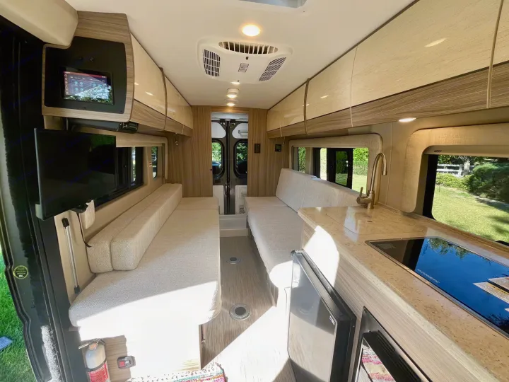 Spacious RV rental interior with modern kitchen, comfortable seating, and essential amenities for travel.. Entegra Coach Ethos 2023