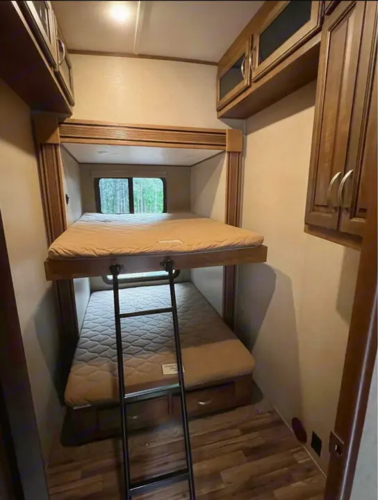 Spacious RV bunk beds: upper & lower beds, ladder, and window views. Ideal for your next rv rental trip!. Forest River Coachmen Chapparal 2016