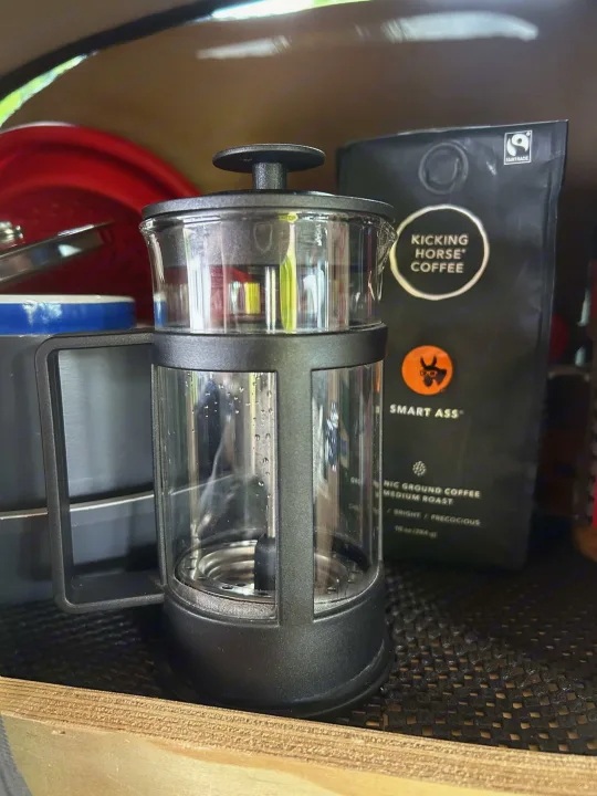 Compact French press and Kicking Horse coffee, perfect for fresh brewing in your rv rental.. Dodge Caravan 2003