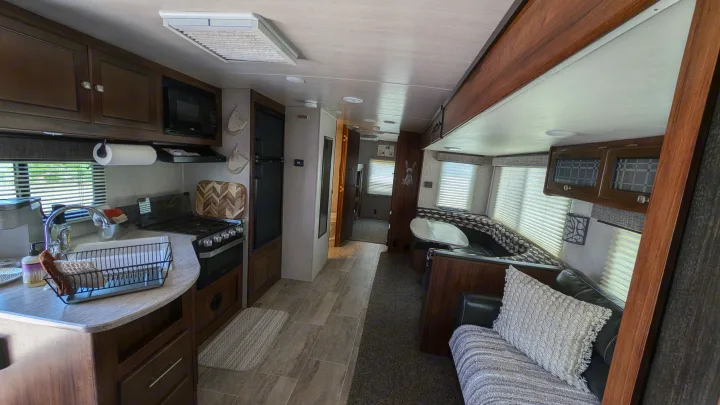 Spacious RV rental interior featuring a full kitchen, comfortable dinette, and inviting living area.. Heartland RVs Mallard 2019