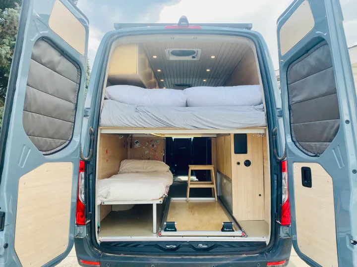 Explore this comfy two-bed RV rental! Perfect for road trips, this custom van conversion features bunk beds & storage.. Mercedes Sprinter 2500 2020