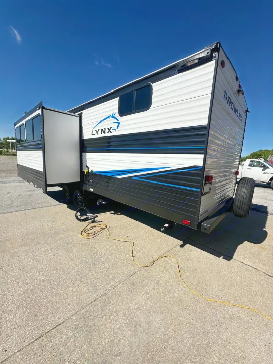 Spacious Lynx Prowler travel trailer, ideal for your next RV rental adventure. Slide-out extended.. Heartland Prowler Lynx 302BHX 2025