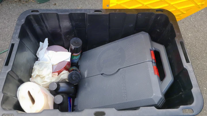 Inside an RV rental storage bin: a Crescent tool kit, brake cleaner, and paper towels for essential upkeep.. Dodge Ram 3500 2002