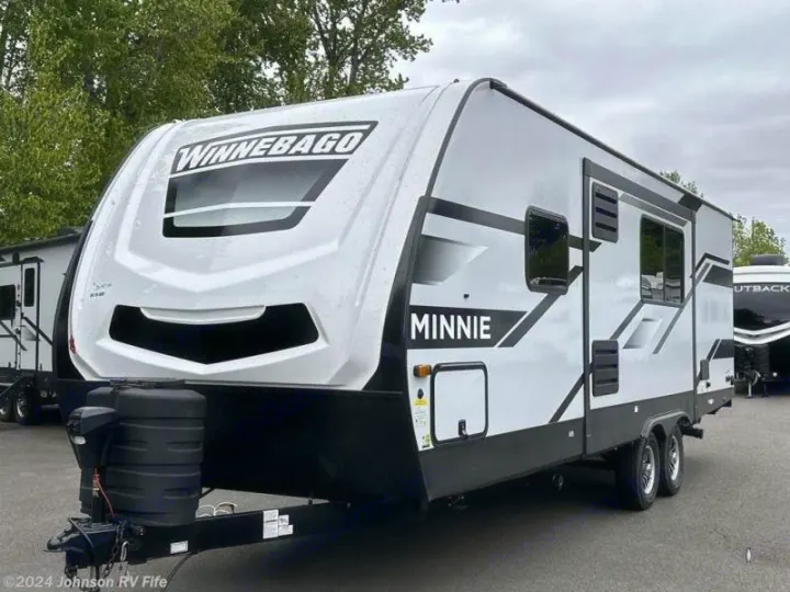 White Winnebago Minnie travel trailer, ideal for your next rv rental adventure. Front view showing sleek design.. Winnebago Minnie 2301BHS 2024