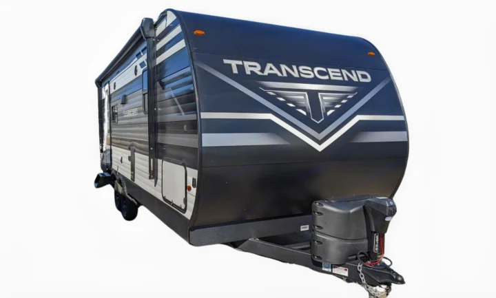Sleek black and gray Transcend travel trailer for RV rental, featuring an awning for outdoor comfort.. Grand Design Transcend Xplor 221RB 2023