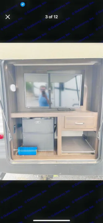 RV rental outdoor kitchen with TV, mini-fridge, and convenient pull-out storage for your adventures.. Keystone RV Summerland 2018