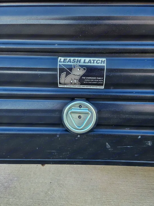 This RV rental has a 'Leash Latch' sticker & 1500lb tie-down. It's for safely securing pets, as the sticker states 'Cherokee Family Cares'.. Forest River Cherokee Wolf Pup 2022