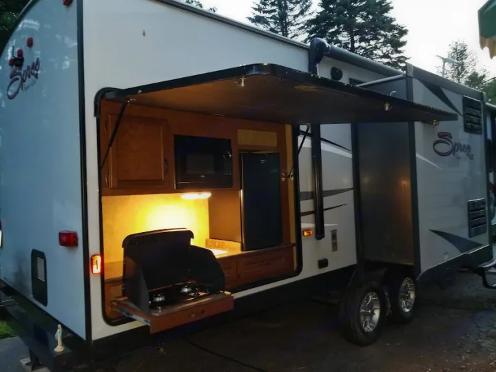 Enjoy an rv rental with a pull-out outdoor kitchen, complete with a stove, microwave, sink, and mini-fridge.. KZ Spree 301RIK 2015