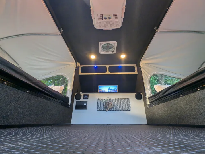 This RV rental's camper interior features comfy beds, climate control (AC/fan), and a textured floor for your adventures.. Intech Flyer Explore 2022