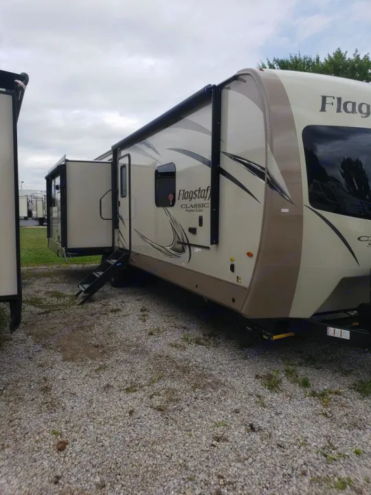 Flagstaff travel trailer with extended slide-out, awning, and steps, ideal for your next RV rental adventure.. Forest River Flagstaff Classic 2019