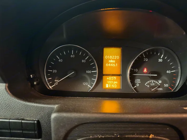 RV rental dashboard: Odometer shows 18,220 miles, 85°F, 1:53 PM. Speedometer, tachometer, and diesel fuel gauge visible.. Forest River Mercedes 2019