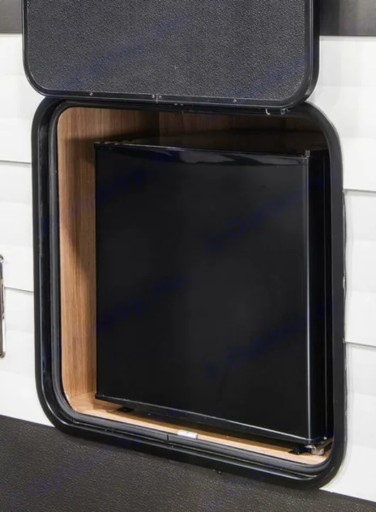 This RV rental features an exterior storage compartment with a black mini-fridge for convenient outdoor cooling.. Cruiser RV Avenir 2024