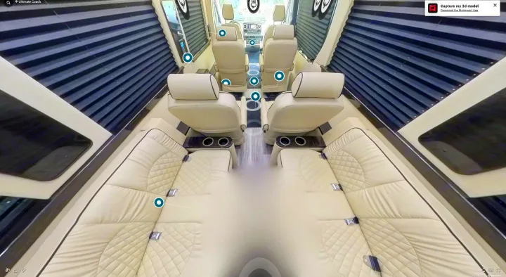 Explore this luxurious RV rental interior: spacious cream leather seating, private blinds, and ample comfort for your journey.. Ultimate Toys Ultimate Coach 2022