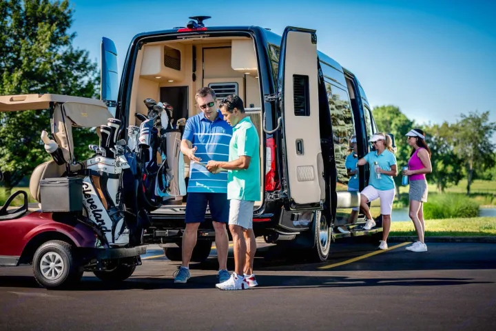 Preparing for a golf day? This luxury RV rental provides ample space for golf bags, a golf cart, and friends.. Ultimate Toys Ultimate Coach 2022