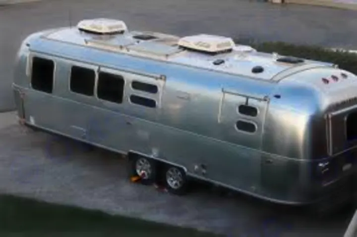 An iconic silver Airstream travel trailer, viewed from above, ready for your next RV rental road trip.. Airstream Flying Cloud 2016