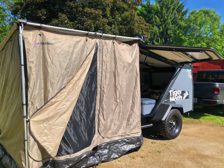Spacious ARB Touring tent attached to a Tiger Moth camper trailer, great for RV rental outdoor experiences.. TAXA TAXA Trailer 2019