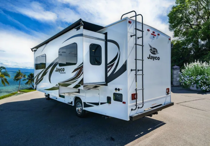 This white Jayco Redhawk RV rental, with its open slide-out and roof ladder, is perfectly set for coastal travel.. Jayco Redhawk 2022