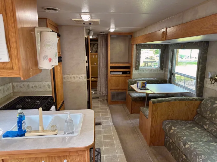 Step into this comfortable RV rental. Features a kitchen with sink, dinette, and sofa. Enjoy your travel adventures.. Jayco Jay Flight 2003