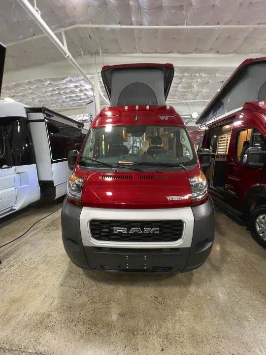 Red Winnebago Ram ProMaster pop-top camper van, ideal for your next RV rental adventure.. Winnebago Solis 2023