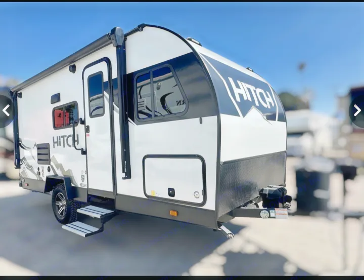Modern white and black "Hitch" travel trailer, perfect for your next RV rental adventure.. Cruiser RV Hitch 2022