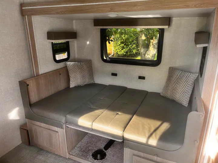 Experience comfort in this RV rental! Functional dinette converts to a bed, with warm wood tones & textured walls.. Forest River Rockwood Geo Pro 2021