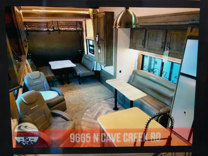 Spacious RV rental interior: living area, kitchen, and recliners in a modern recreational vehicle.. Forest River Stealth 2020