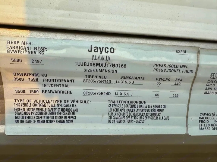 An RV rental data label from Jayco, detailing VIN, weight ratings, tire size, and inflation pressure.. Jayco Jay Flight 2018