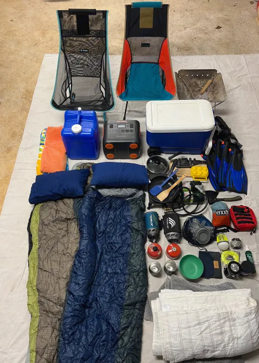 Essential gear for your RV rental adventure: camping chairs, cooking supplies, sleeping bags, and more laid out for packing.. Jeep Wrangler 2008
