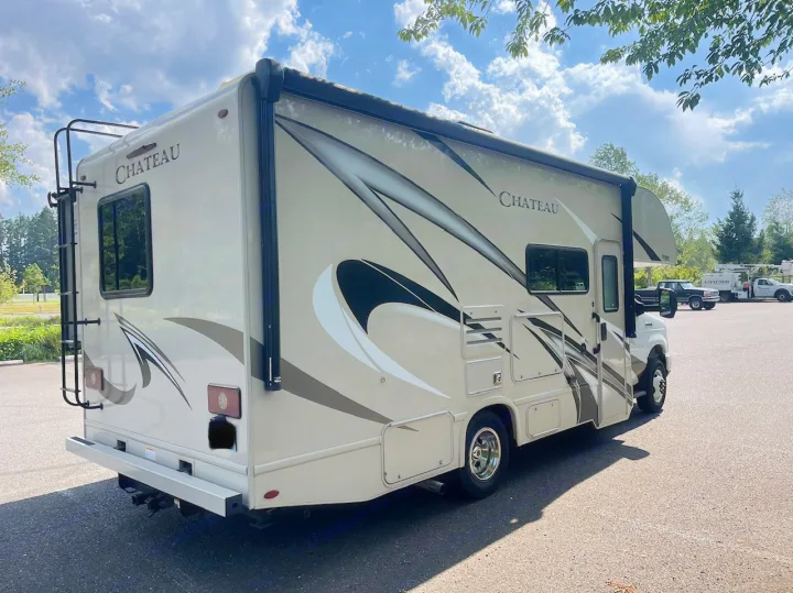 Spacious Chateau Class C RV rental, ready for adventure. Parked outdoors on a sunny day.. Thor Chateau 2019